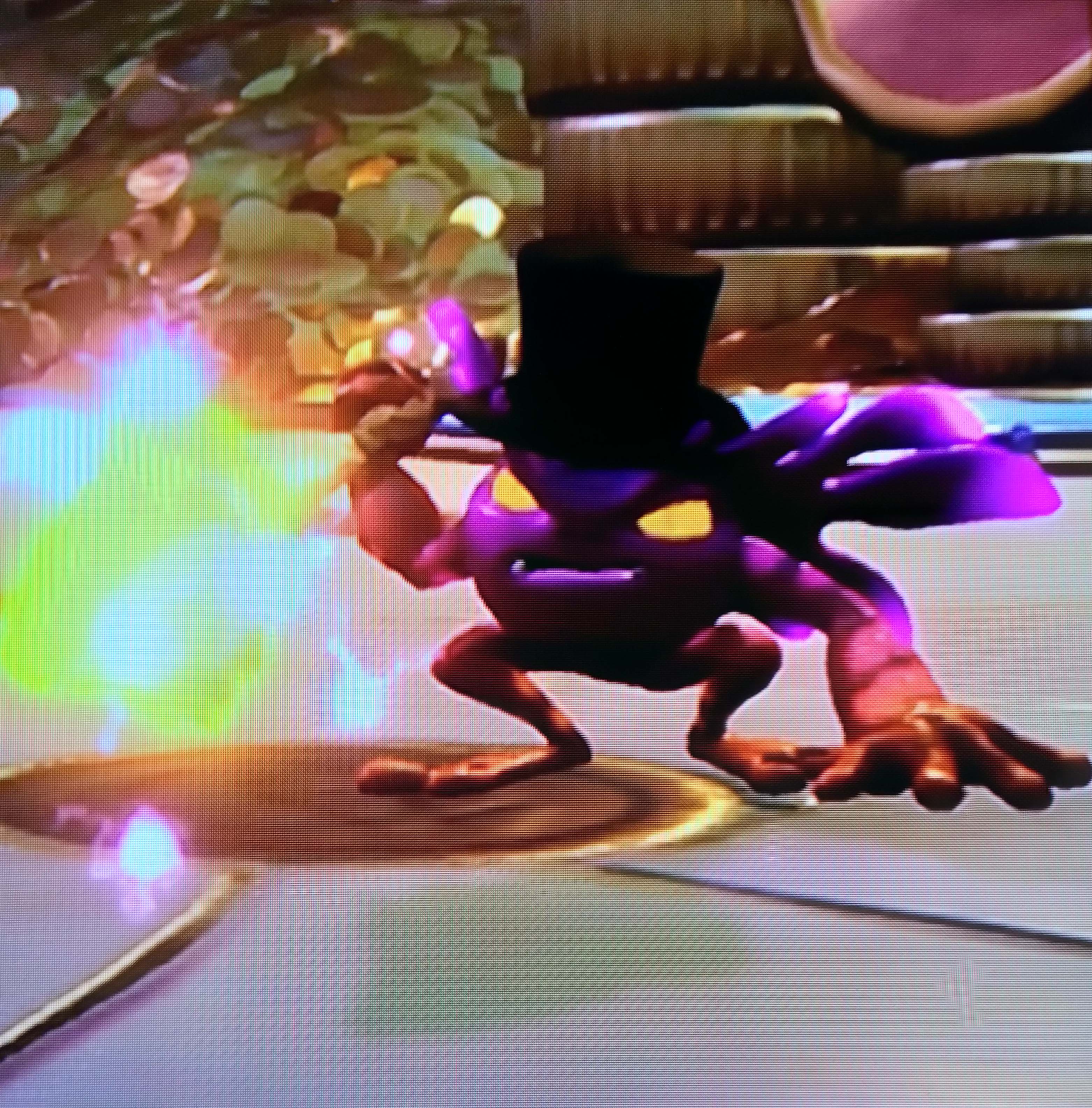 Glob Goblin wearing a black top hat in the Golden Arcade